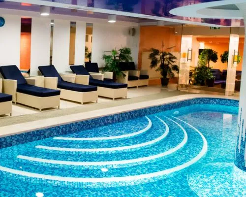 Elegant living room with blue ottoman